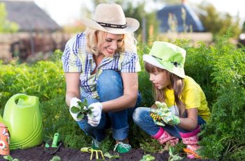 Woman and daughter are gardening, which is symbolically similar to growing your business.
