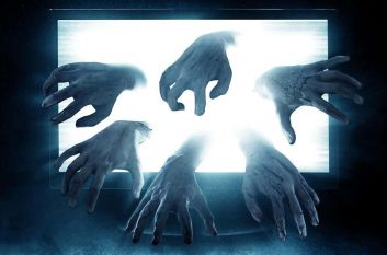 Ghostly hands reach out of laptop screen, signaling AV issues.